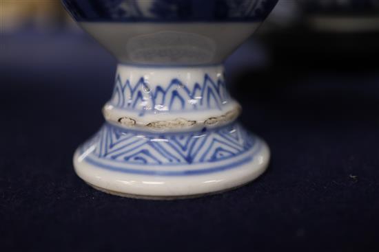 A Chinese blue and white tea bowl and saucer and two jars, Kangxi, some damage, largest diameter 11cm